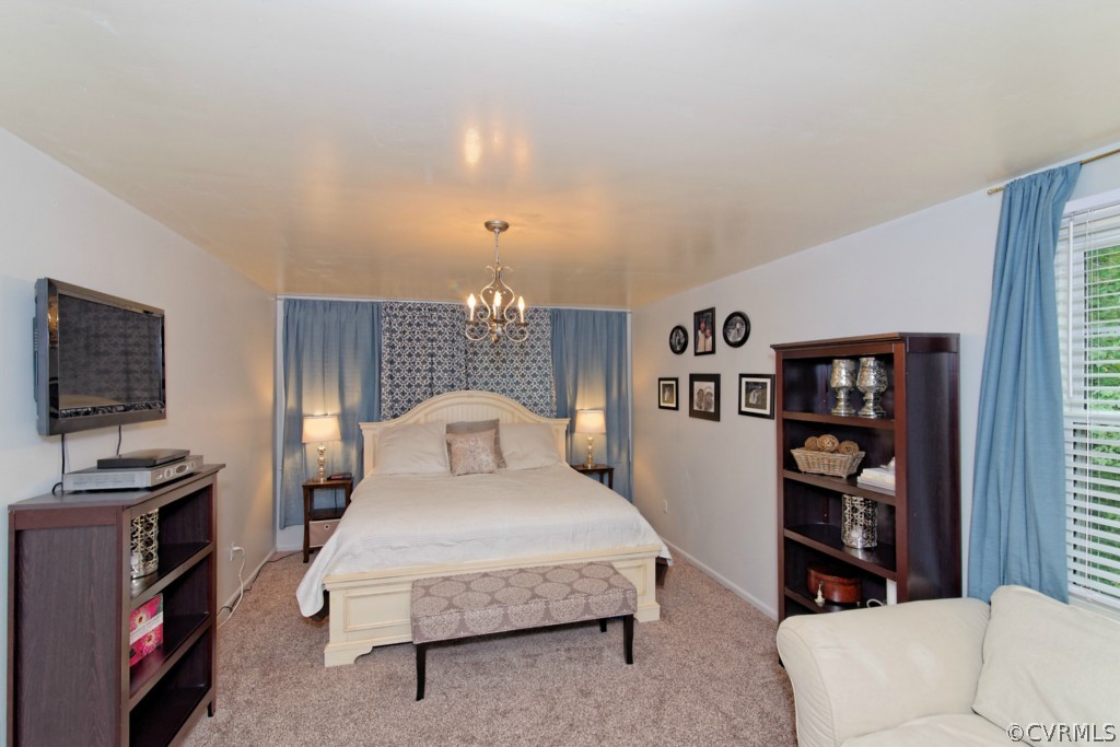 4908 Court Ridge Terrace Midlothian, VA 23112 - Photo 19 of 24 a bedroom with a bed furniture and a flat screen tv
