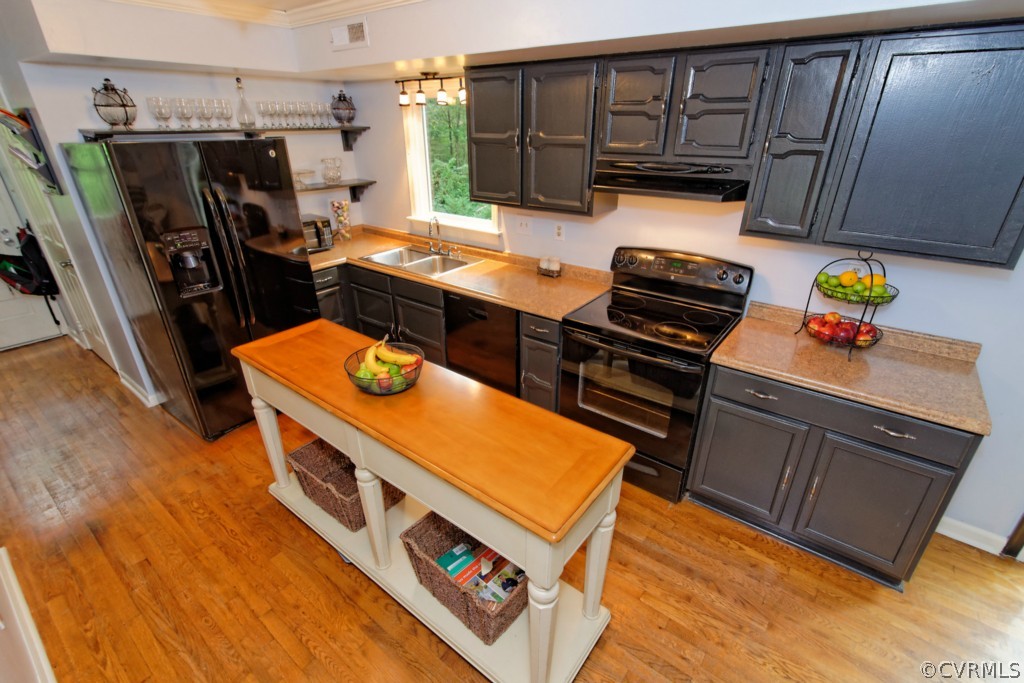 4908 Court Ridge Terrace Midlothian, VA 23112 - Photo 2 of 24 a kitchen with stainless steel appliances a stove top oven a sink and a refrigerator