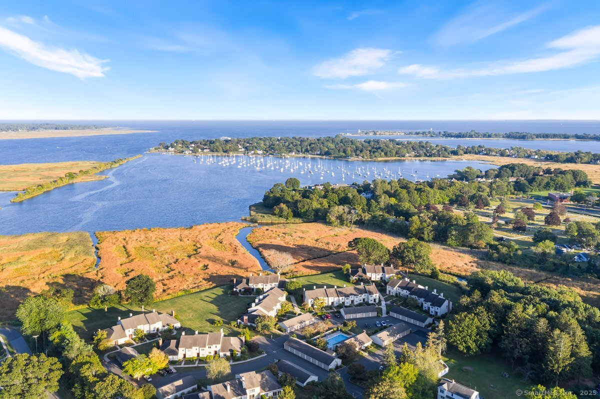100 Dudley Avenue, Unit H43 Old Saybrook, CT 06475 - Photo 1 of 35 an aerial view of lake and residential houses with outdoor space