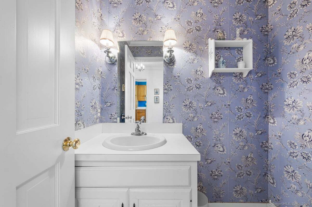 100 Dudley Avenue, Unit H43 Old Saybrook, CT 06475 - Photo 13 of 35 a bathroom with a sink and a mirror