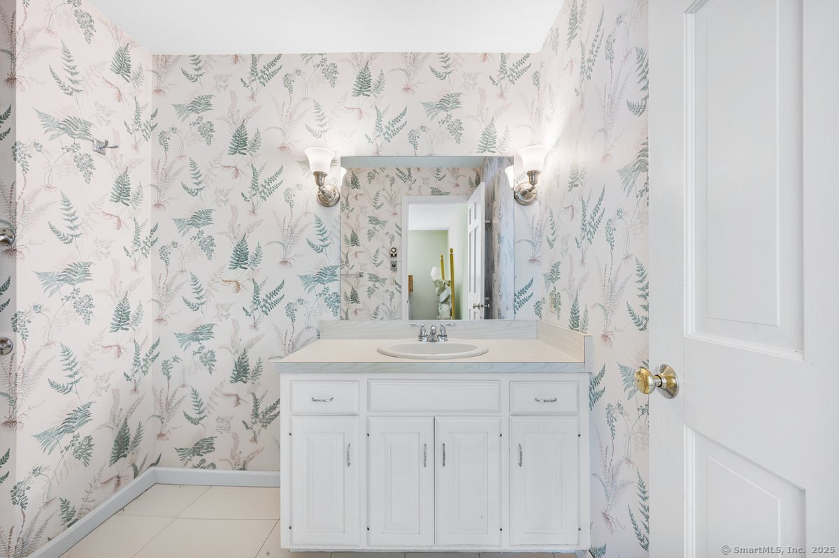 100 Dudley Avenue, Unit H43 Old Saybrook, CT 06475 - Photo 17 of 35 a bathroom with a sink and a mirror
