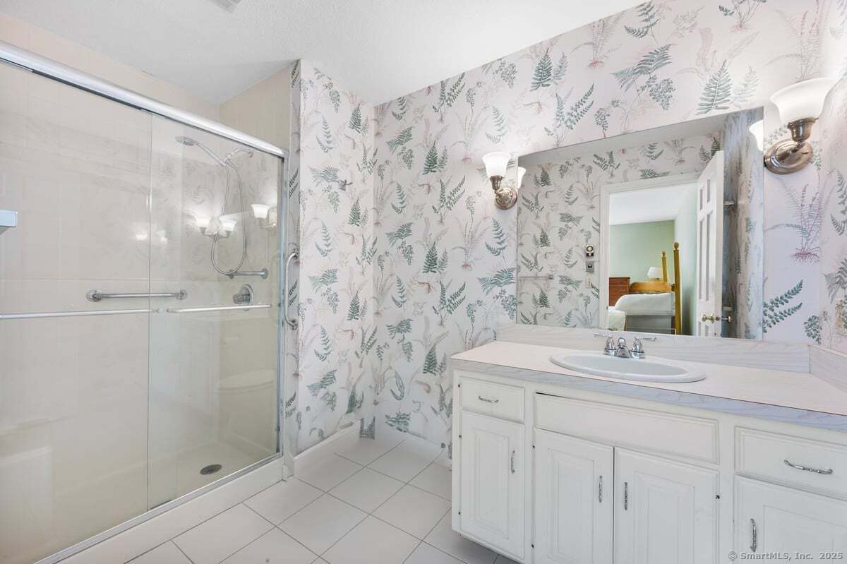 100 Dudley Avenue, Unit H43 Old Saybrook, CT 06475 - Photo 18 of 35 a bathroom with a sink and a mirror