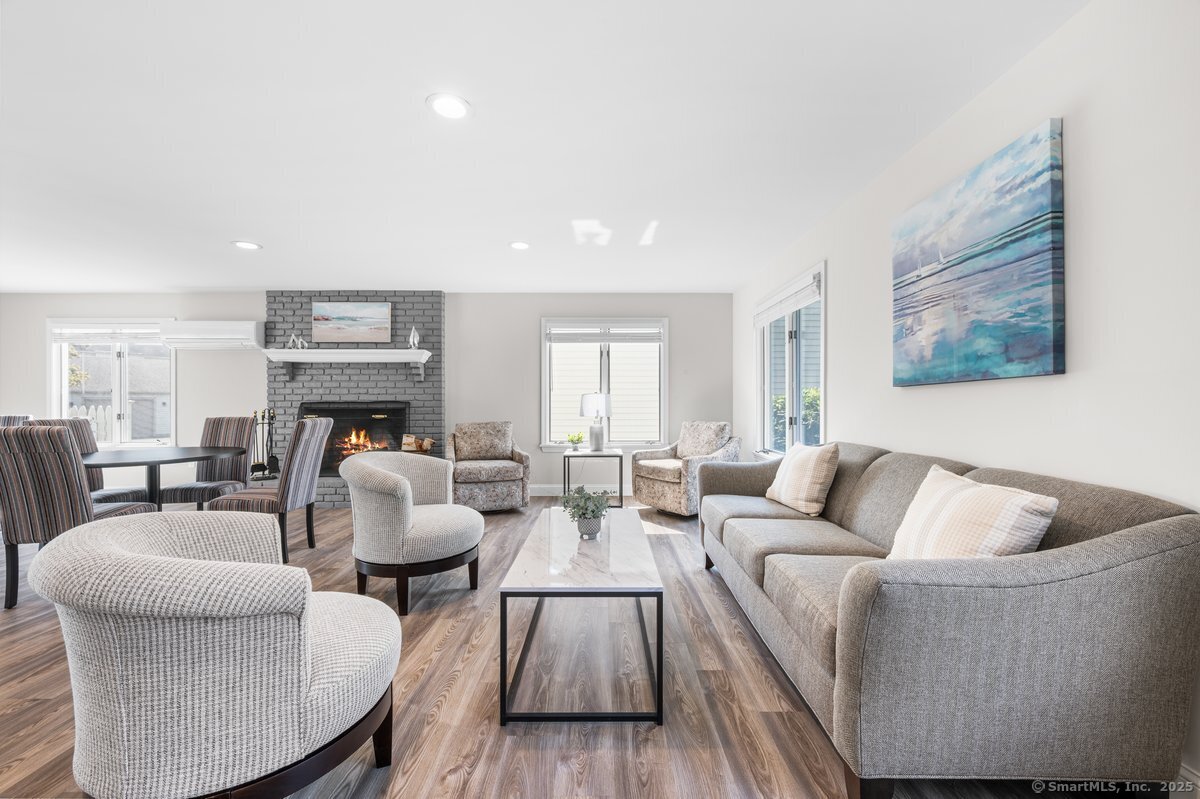 100 Dudley Avenue, Unit H43 Old Saybrook, CT 06475 - Photo 31 of 35 a living room with furniture and a fireplace