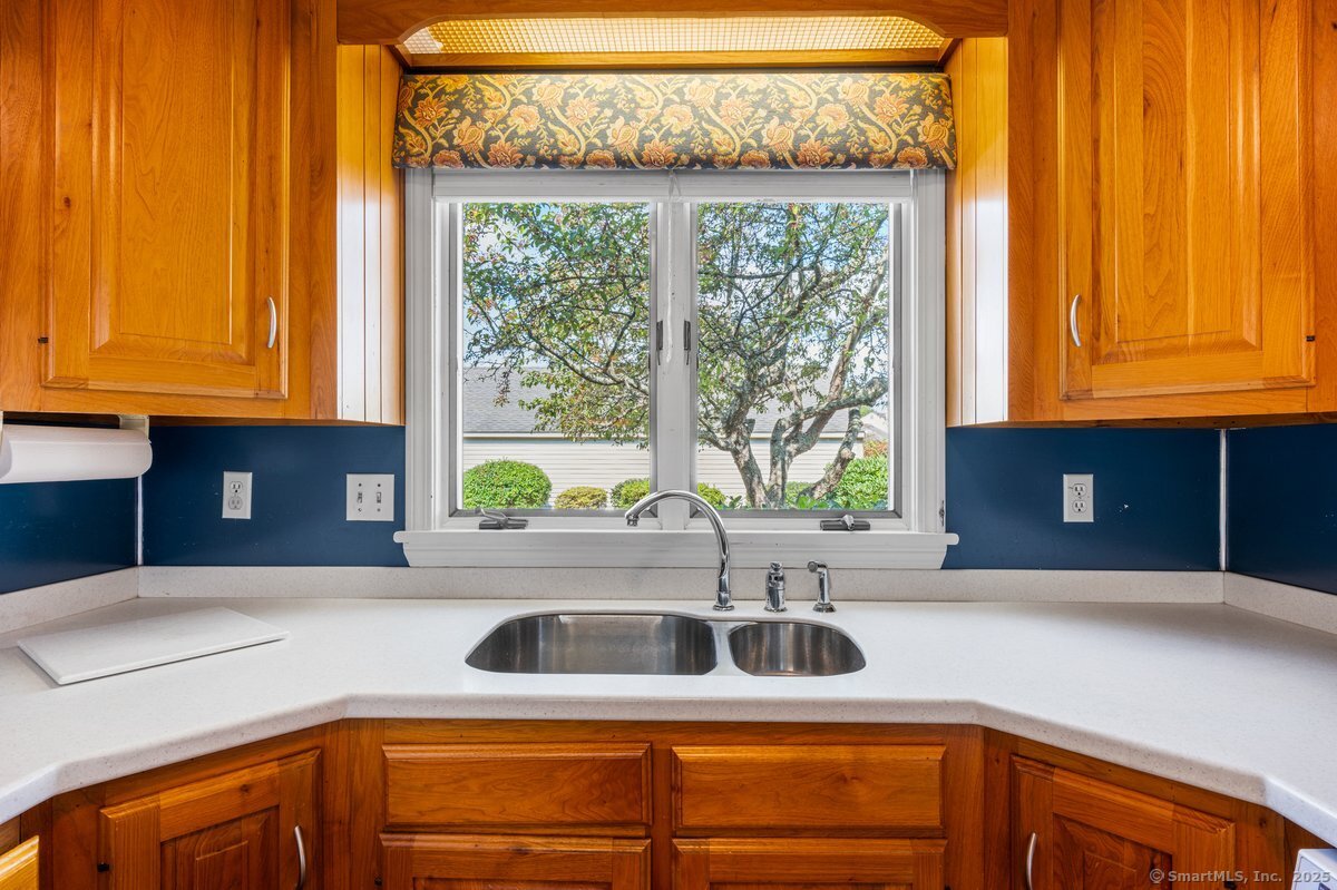 100 Dudley Avenue, Unit H43 Old Saybrook, CT 06475 - Photo 5 of 35 a kitchen with a sink and large window