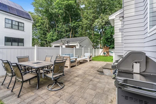 a view of a dinning table and chairs in the patio
