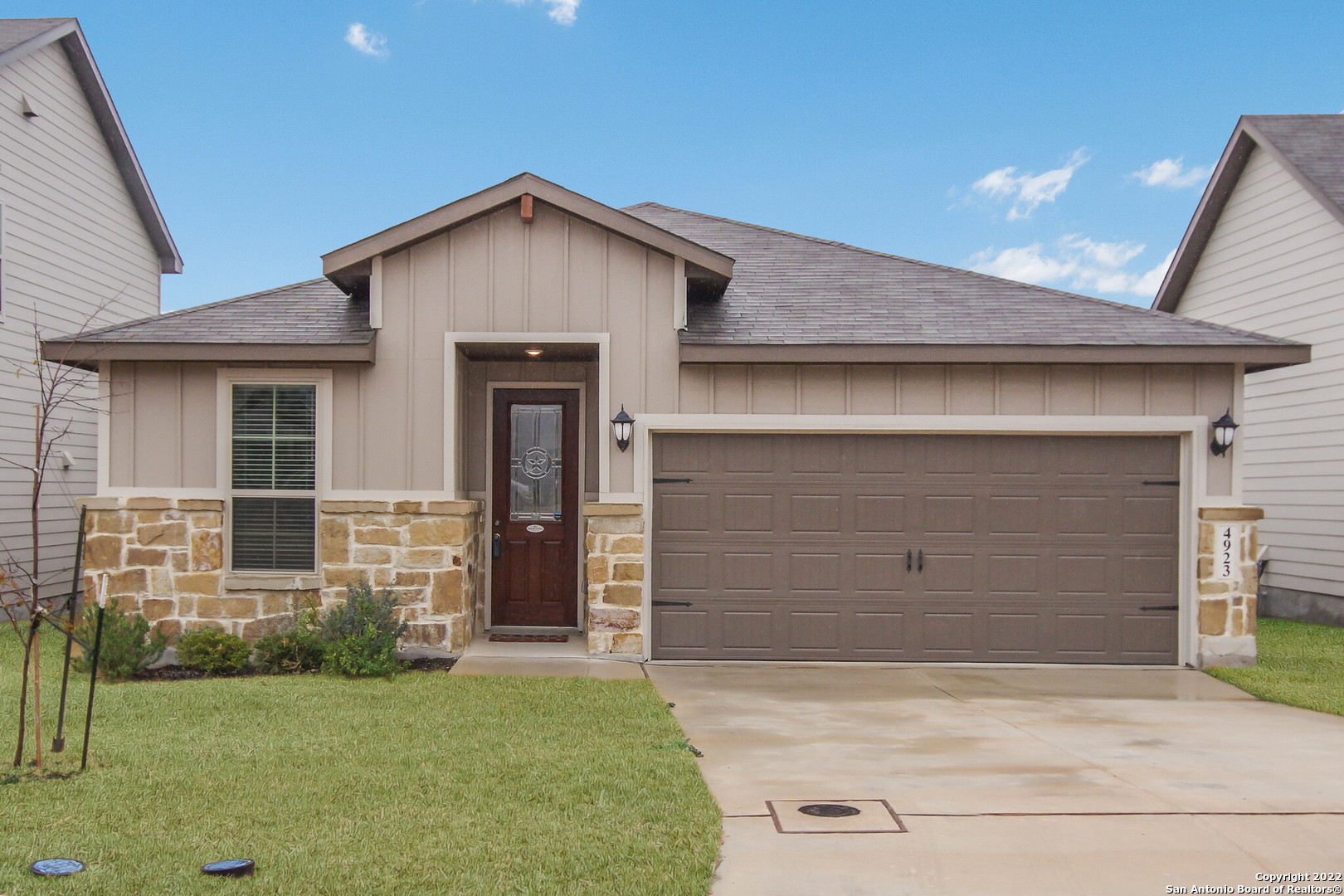 a front view of a house with garden