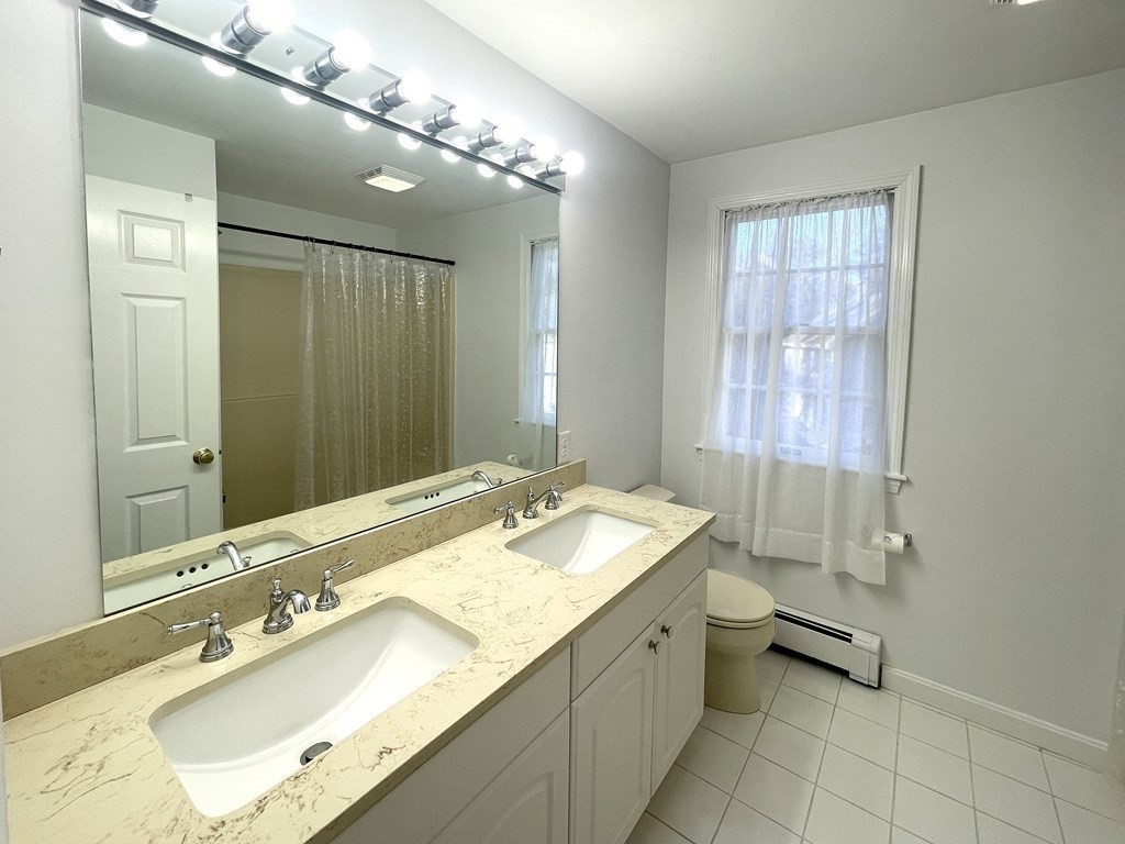 25 Wedgewood Drive Barnstable, MA 02632 - Photo 17 of 20 a bathroom with a double vanity sink mirror and double