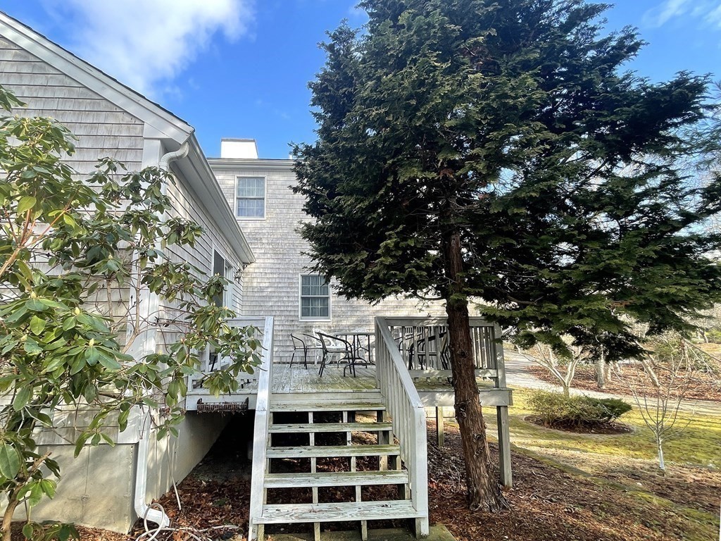 25 Wedgewood Drive Barnstable, MA 02632 - Photo 5 of 20 a front view of a house with a tree