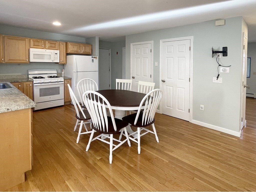 25 Wedgewood Drive Barnstable, MA 02632 - Photo 10 of 20 a view of a dining room with furniture and wooden floor
