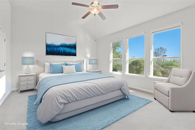 a bedroom with a bed and a couch