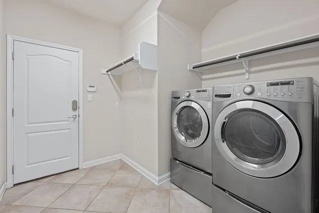 a view of storage and utility room with washer and dryer