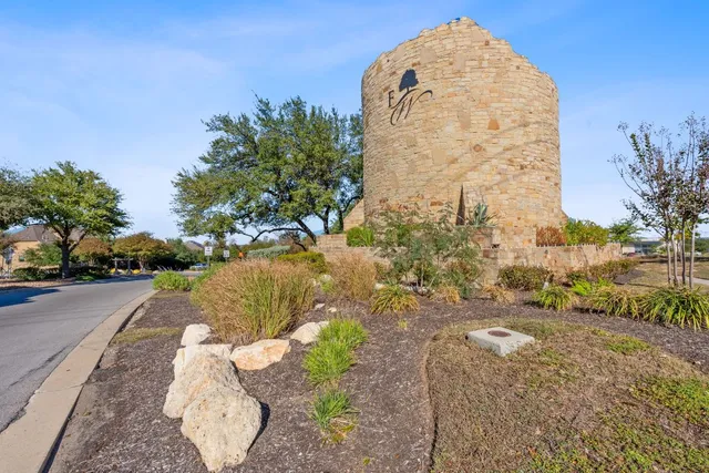 a view of a pathway with a fountain