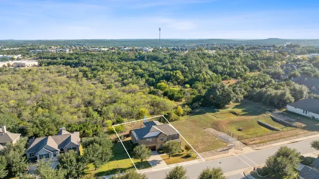 an aerial view of residential house with outdoor space