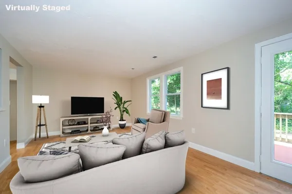 a view of an empty room and wooden floor