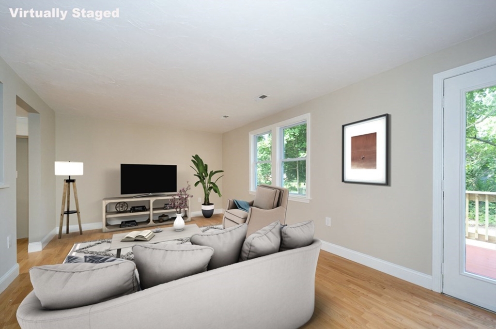 7 - Sherman Terrace, Unit 7 Natick, MA 01760 - Photo 11 of 26 a living room with furniture and a flat screen tv