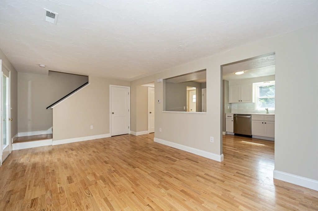 7 - Sherman Terrace, Unit 7 Natick, MA 01760 - Photo 14 of 26 a view of a big room with wooden floor and a kitchen