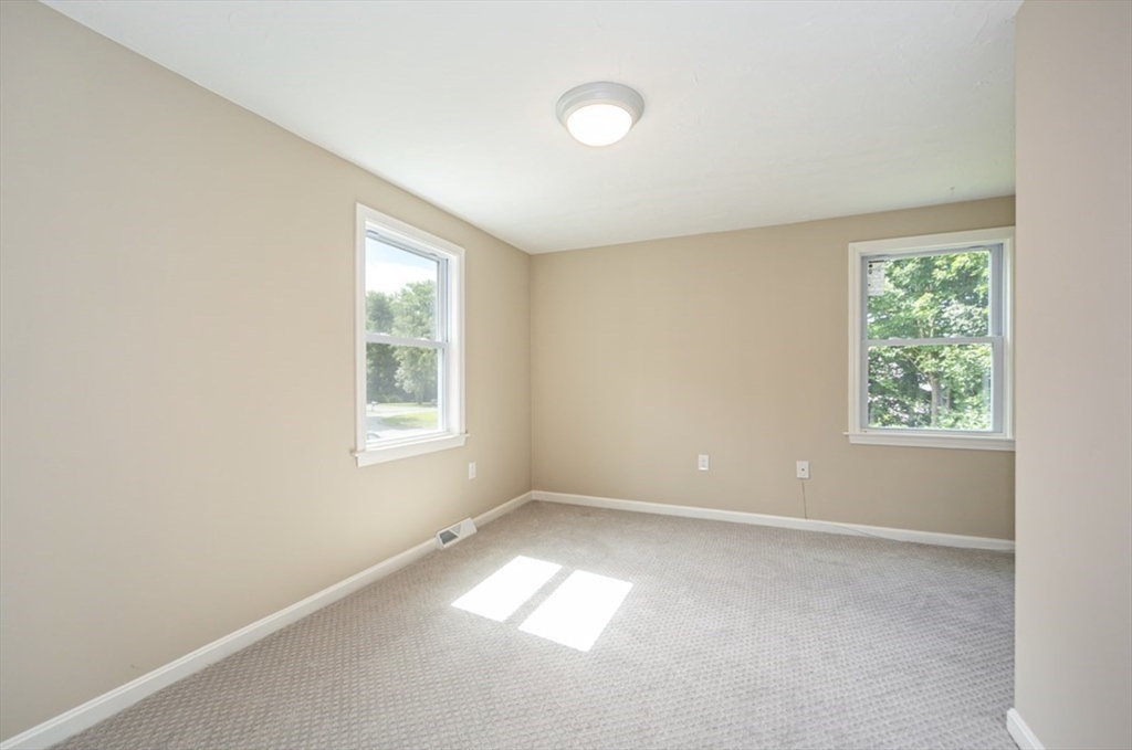 7 - Sherman Terrace, Unit 7 Natick, MA 01760 - Photo 16 of 26 an empty room with windows