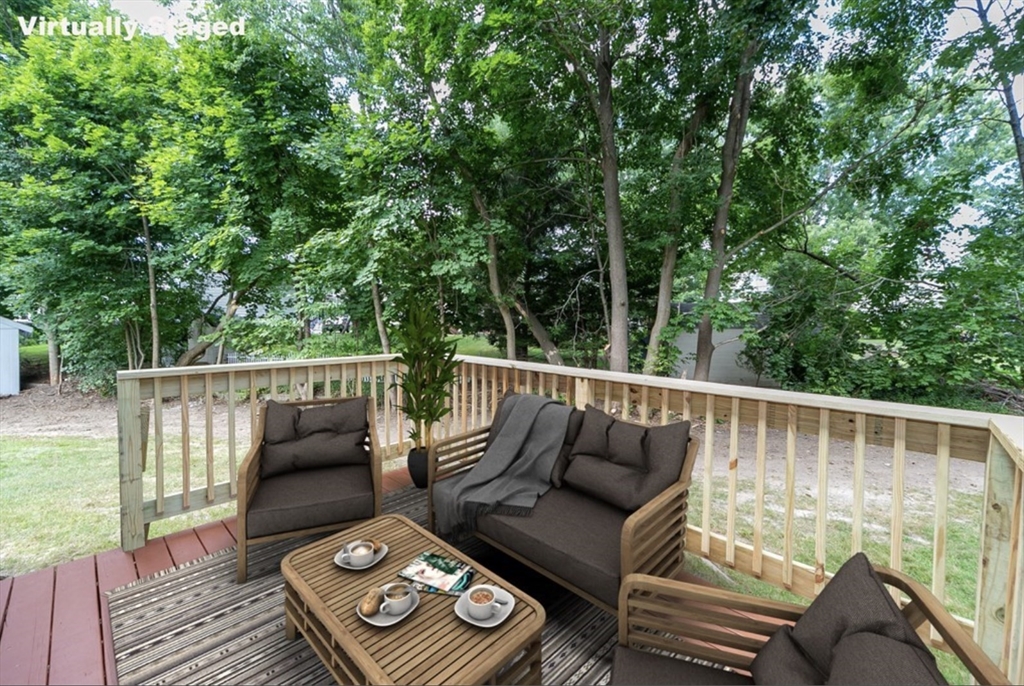 7 - Sherman Terrace, Unit 7 Natick, MA 01760 - Photo 25 of 26 a balcony with wooden floor and outdoor seating