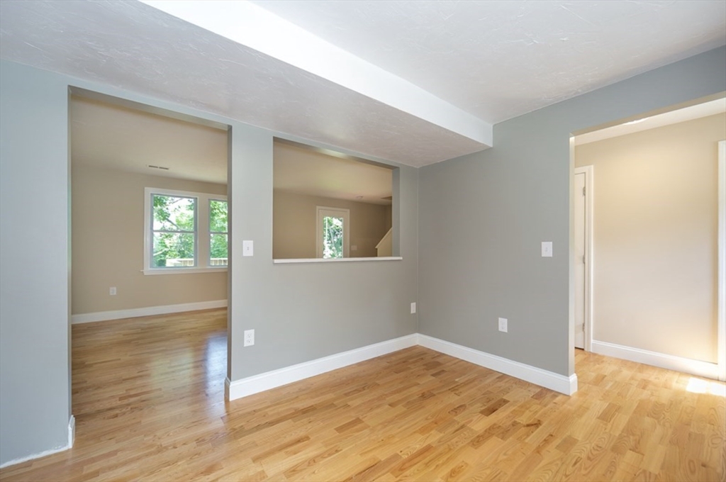 7 - Sherman Terrace, Unit 7 Natick, MA 01760 - Photo 9 of 26 an empty room with wooden floor and windows