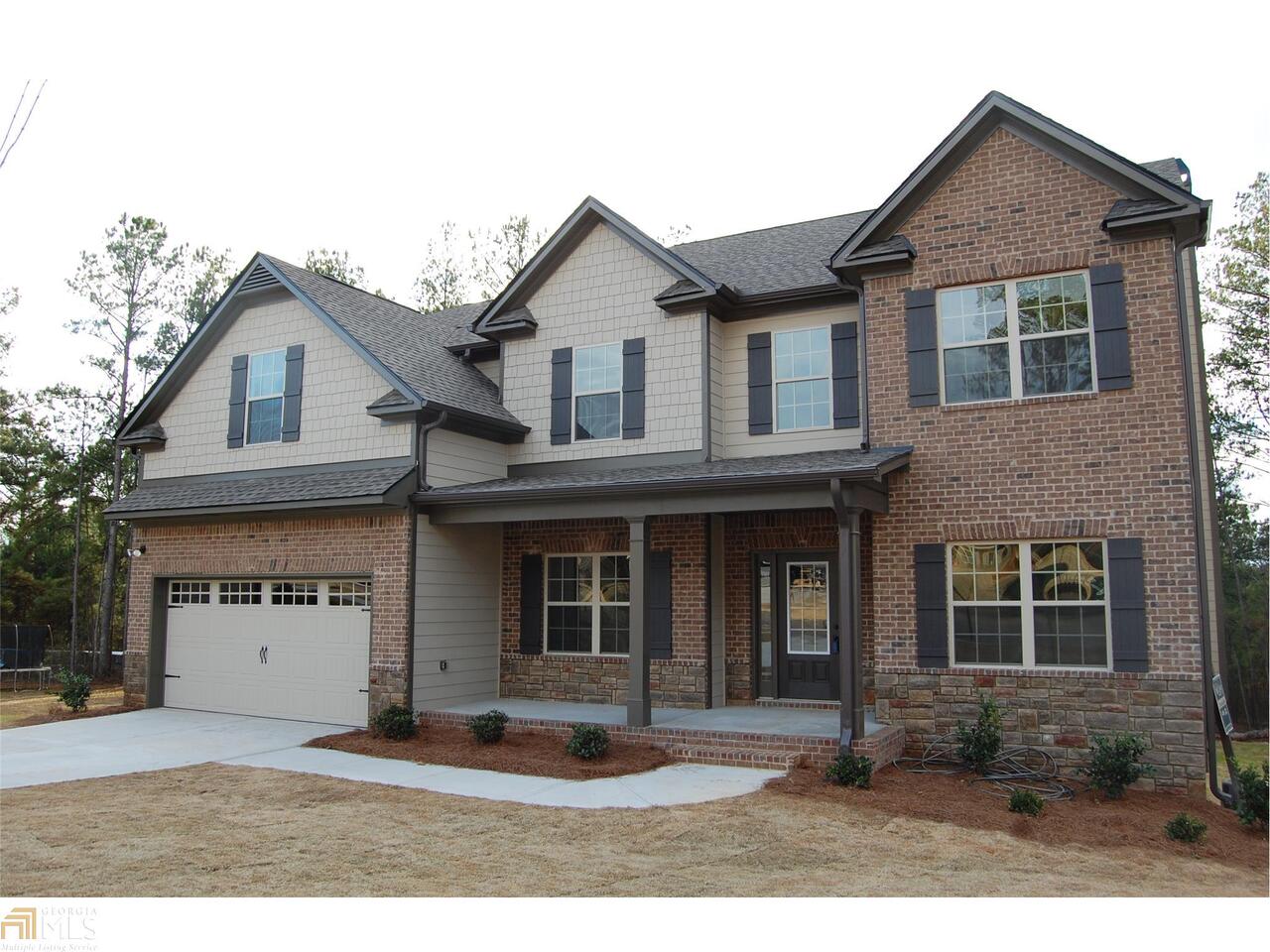 484 Copper Ridge Drive, Unit 22 Loganville, GA 30052 - Photo 1 of 1 a front view of a house with a yard