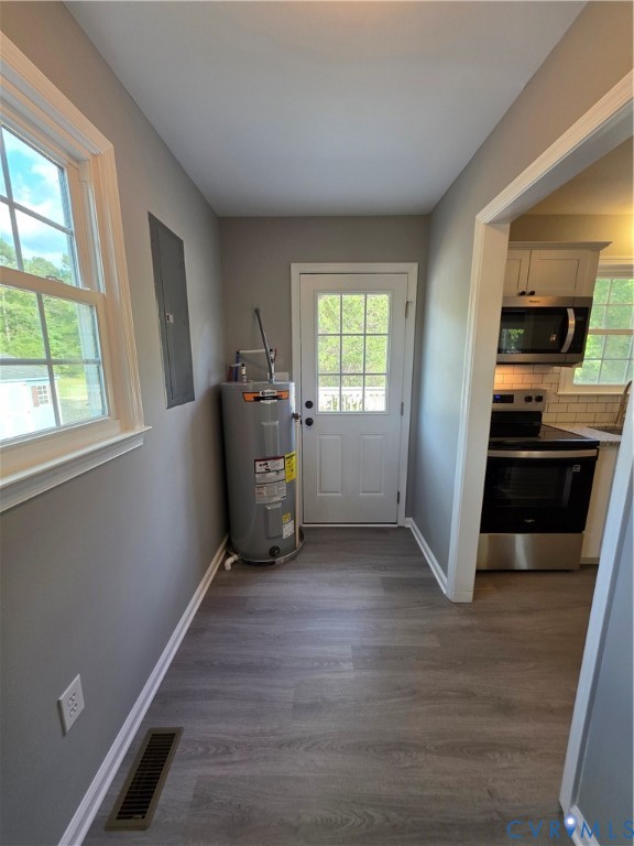 7613 Squirrel Level Road Petersburg, VA 23805 - Photo 19 of 30 LVP flooring throughout, white trim, and a window