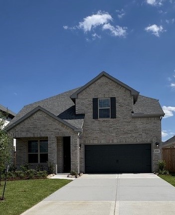 15166 Wild Gully Way Conroe, TX 77302 - Photo 3 of 21 a front view of a house with a yard