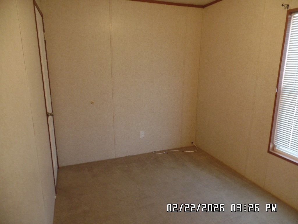 686 Ramar Road Bullhead City, AZ 86442 - Photo 17 of 22 an empty room with windows