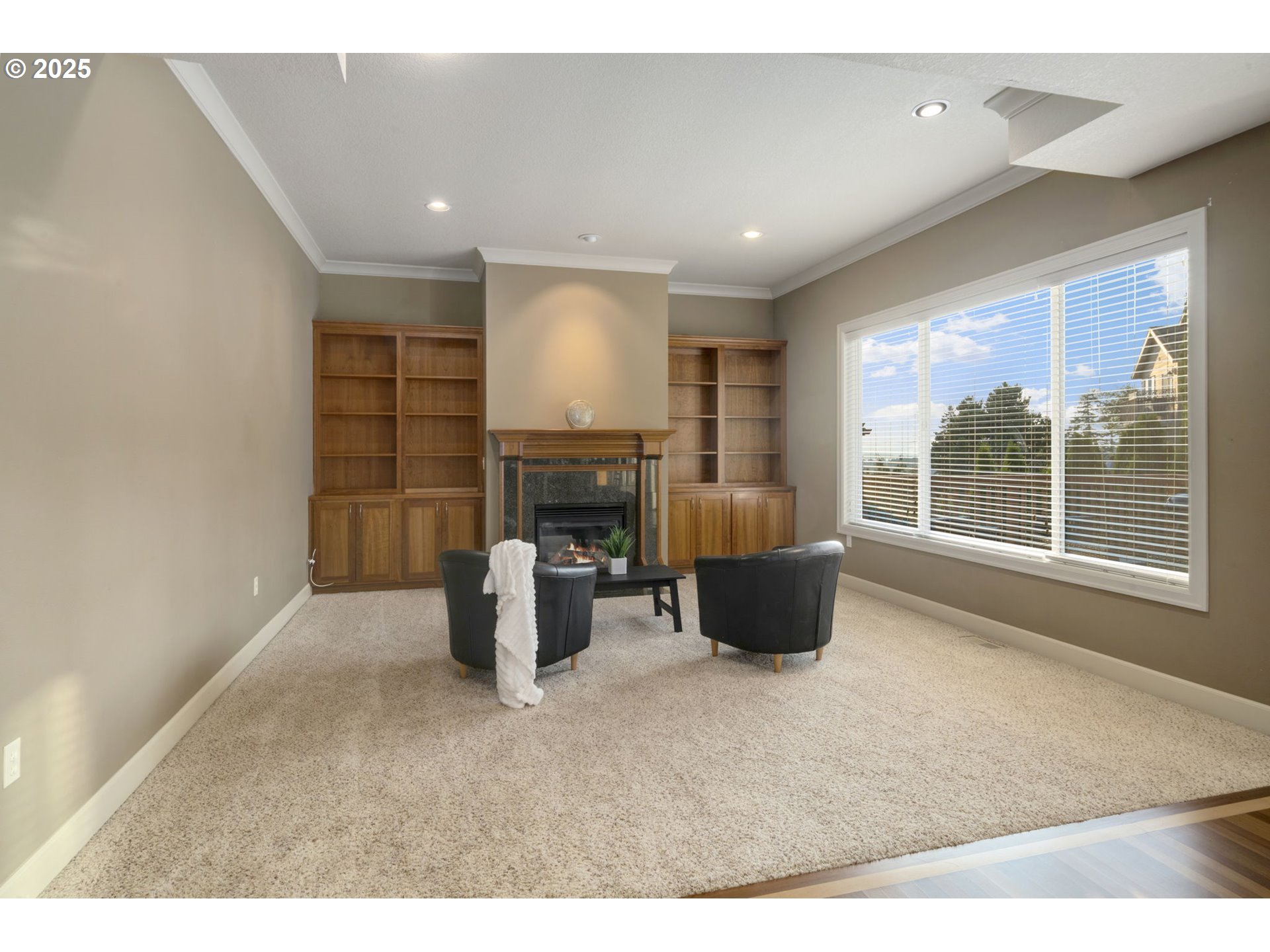 5219 Northwest Fernridge Drive Camas, WA 98607 - Photo 11 of 48 a living room with furniture a fireplace and a large window