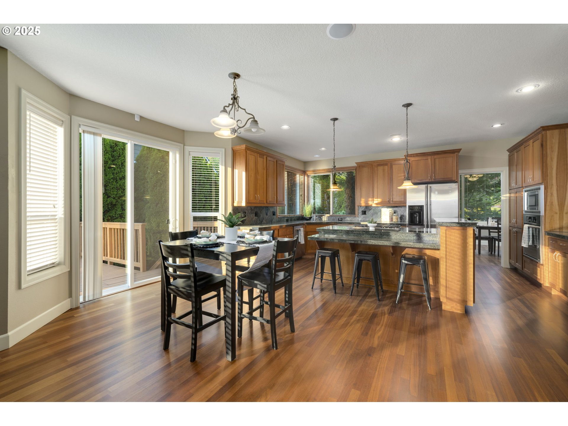 5219 Northwest Fernridge Drive Camas, WA 98607 - Photo 13 of 48 a open kitchen with a table and chairs