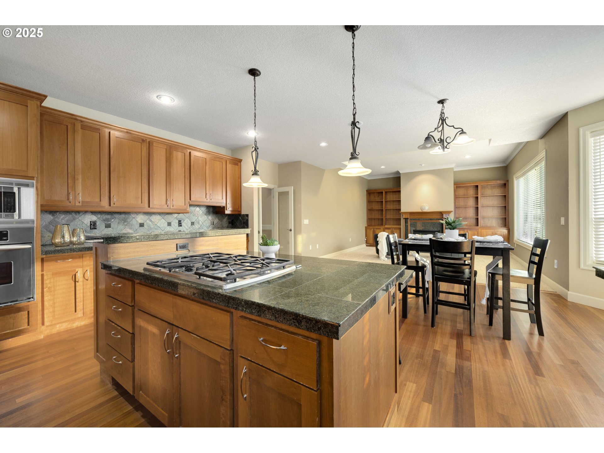 5219 Northwest Fernridge Drive Camas, WA 98607 - Photo 15 of 48 a kitchen with a table and chairs in it