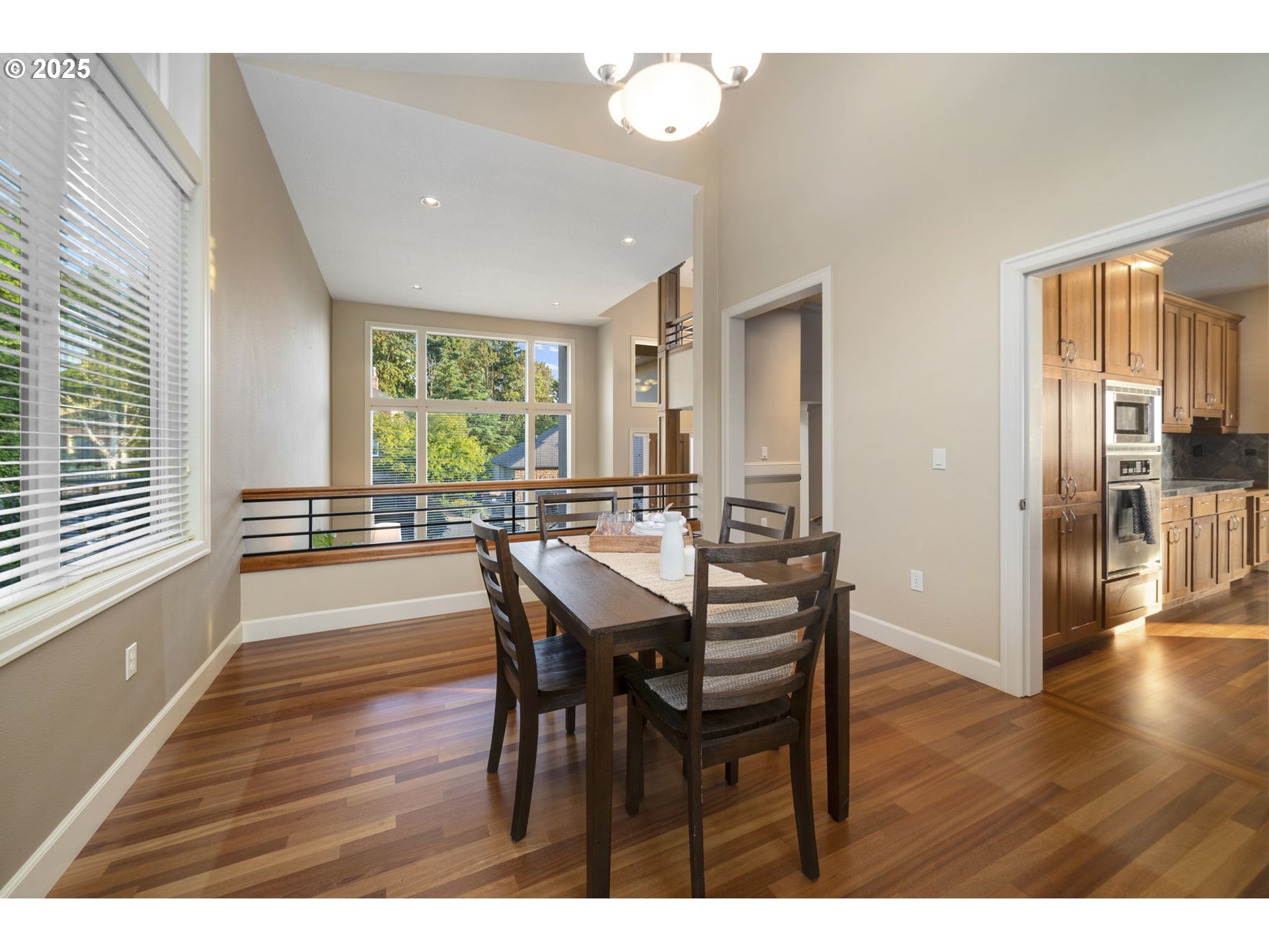 5219 Northwest Fernridge Drive Camas, WA 98607 - Photo 16 of 48 a view of a dining room with furniture window and wooden floor