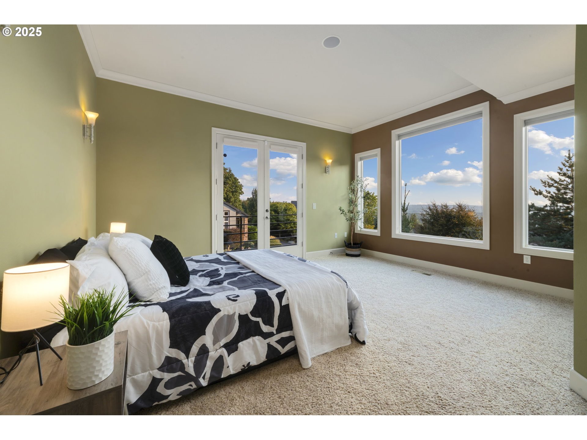 5219 Northwest Fernridge Drive Camas, WA 98607 - Photo 18 of 48 a bedroom with a bed and glass window
