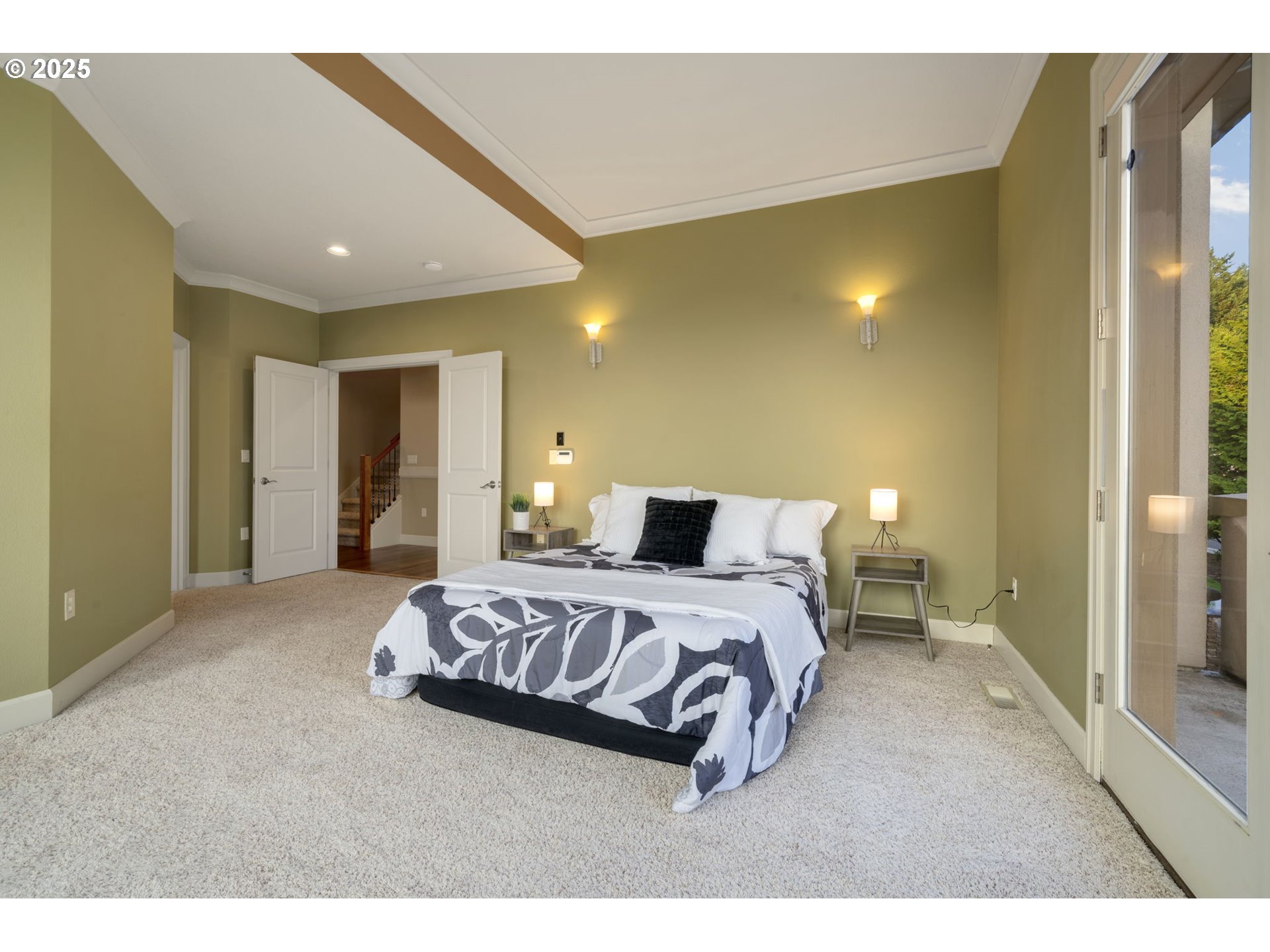 5219 Northwest Fernridge Drive Camas, WA 98607 - Photo 19 of 48 a spacious bedroom with a bed and a couch