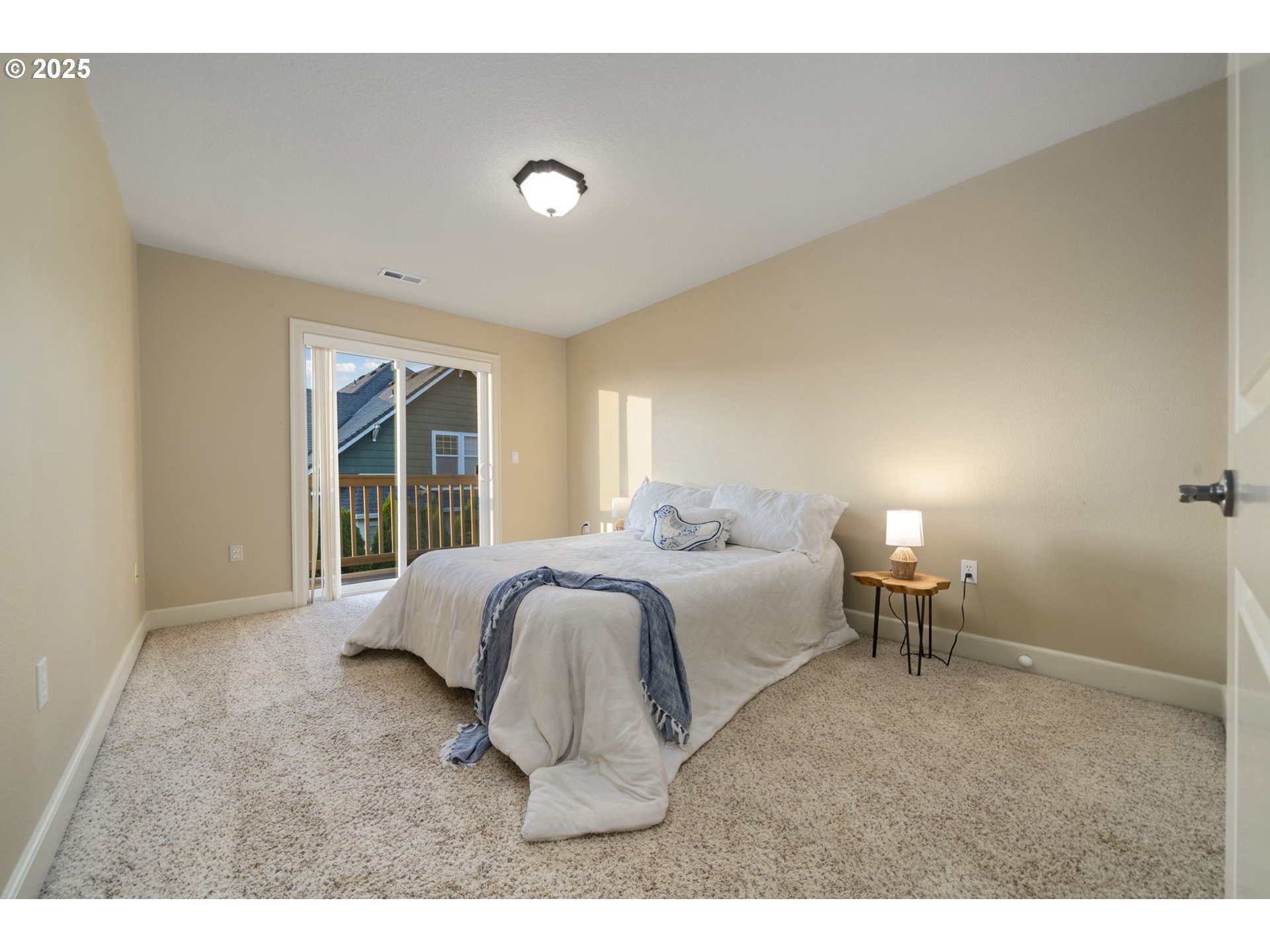 5219 Northwest Fernridge Drive Camas, WA 98607 - Photo 20 of 48 a bedroom with a bed and a large window