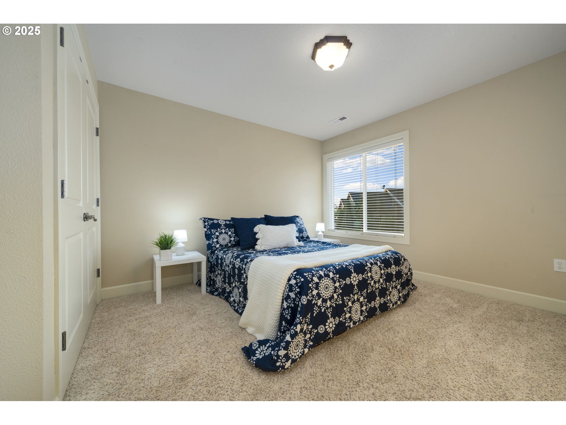 5219 Northwest Fernridge Drive Camas, WA 98607 - Photo 21 of 48 a bed sitting in a spacious bedroom next to a window