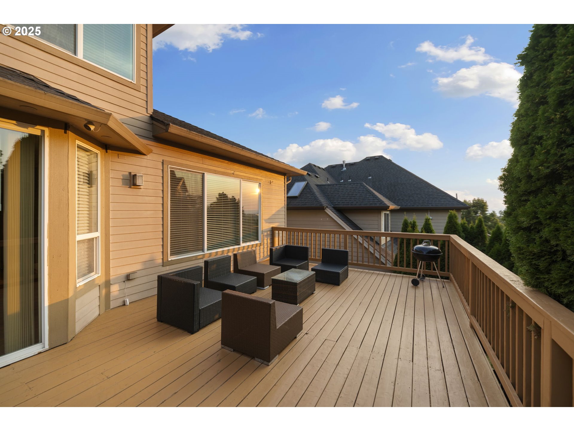 5219 Northwest Fernridge Drive Camas, WA 98607 - Photo 34 of 48 a terrace of a house with wooden floor and outdoor seating