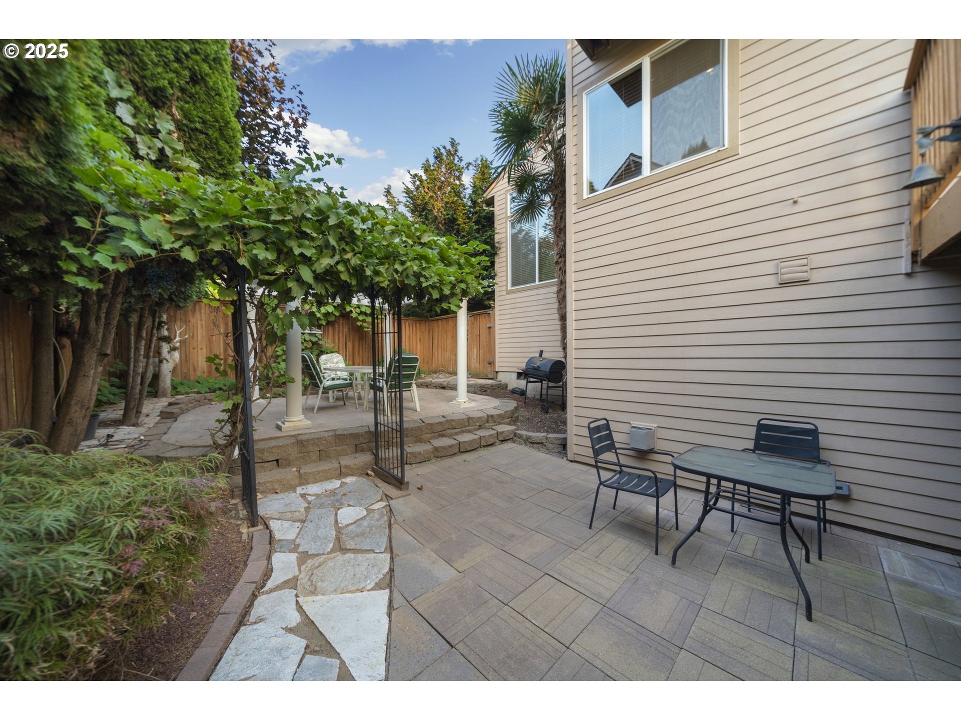 5219 Northwest Fernridge Drive Camas, WA 98607 - Photo 39 of 48 a backyard of a house with table and chairs