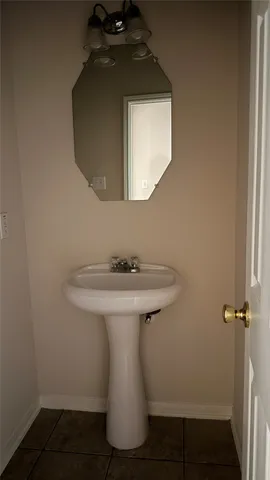 a bathroom with a sink and mirror