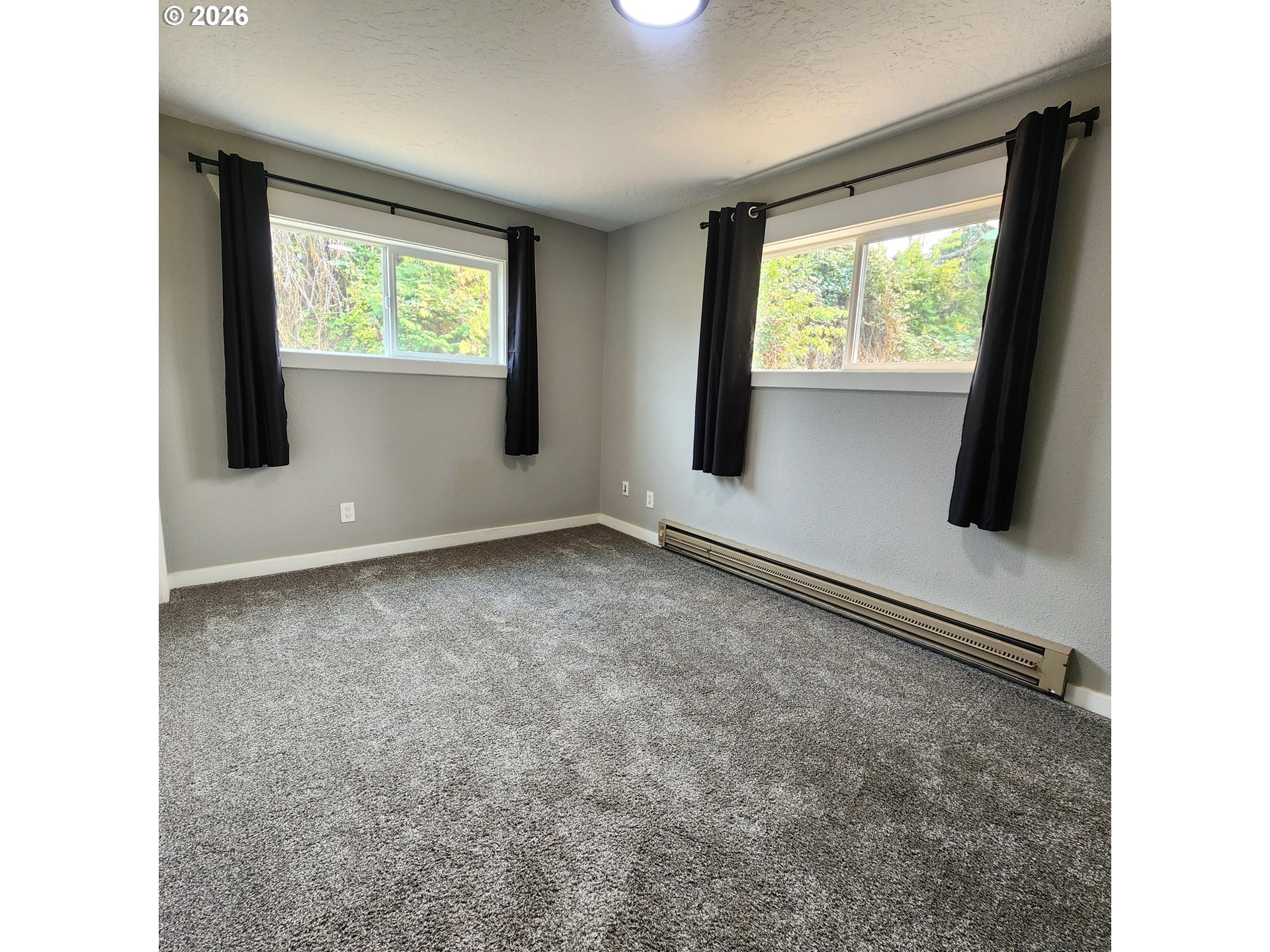54047 West Lane Road Scappoose, OR 97056 - Photo 8 of 44 a view of an empty room with a window