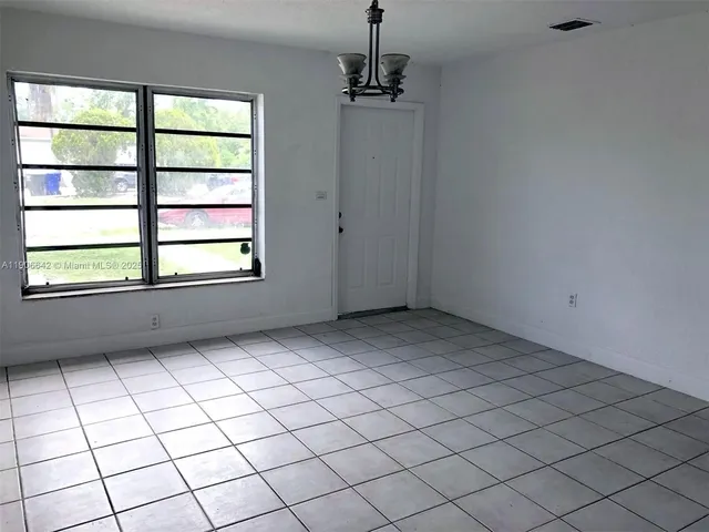 a view of an empty room and window