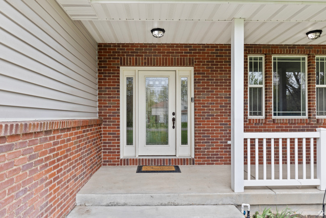 75 East 200 North Mendon, UT 84325 - Photo 5 of 36 Doorway to property featuring brick siding and a porch
