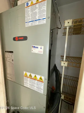 a view of a balcony with yard