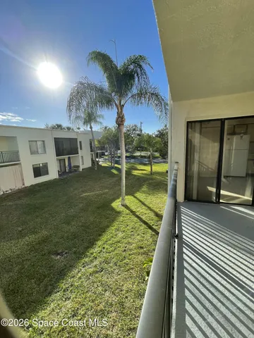 a front view of a building with garden