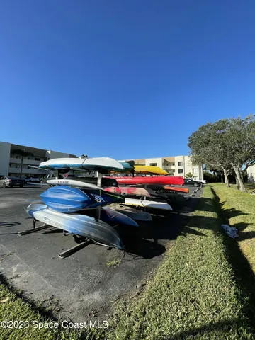 a view of a backyard with swimming pool