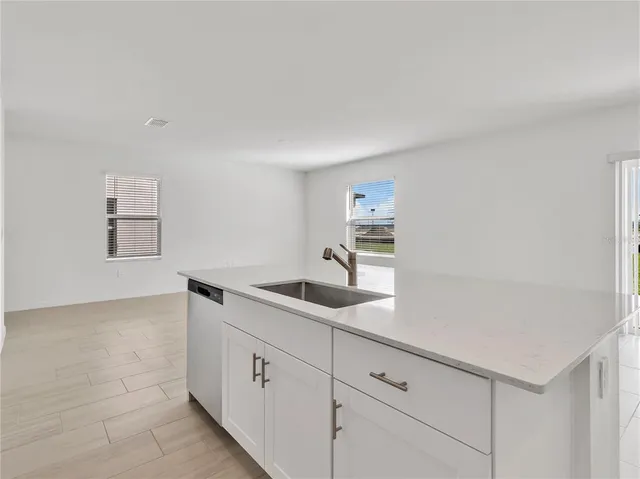 a kitchen with cabinets and sink