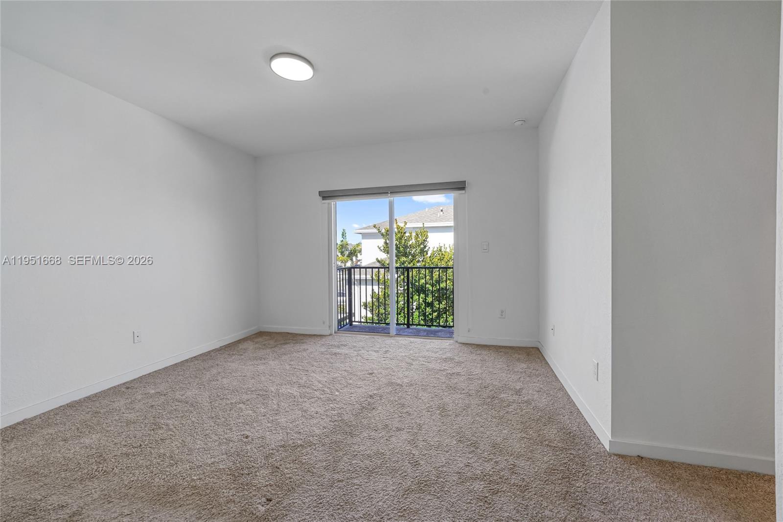 767 Southeast 18th Street Homestead, FL 33034 - Photo 18 of 29 an empty room with windows