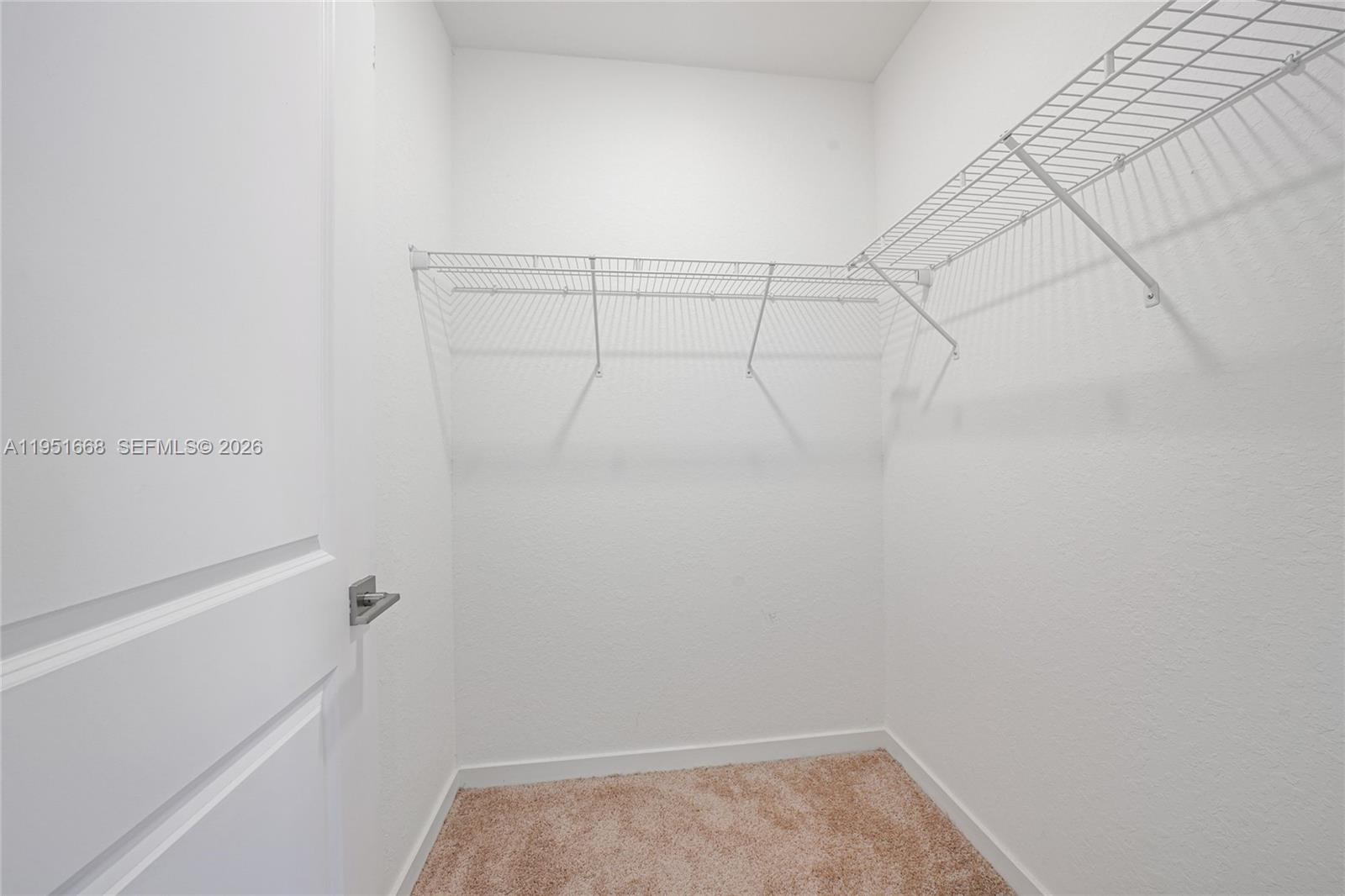 767 Southeast 18th Street Homestead, FL 33034 - Photo 21 of 29 a view of a room with racks on the wall