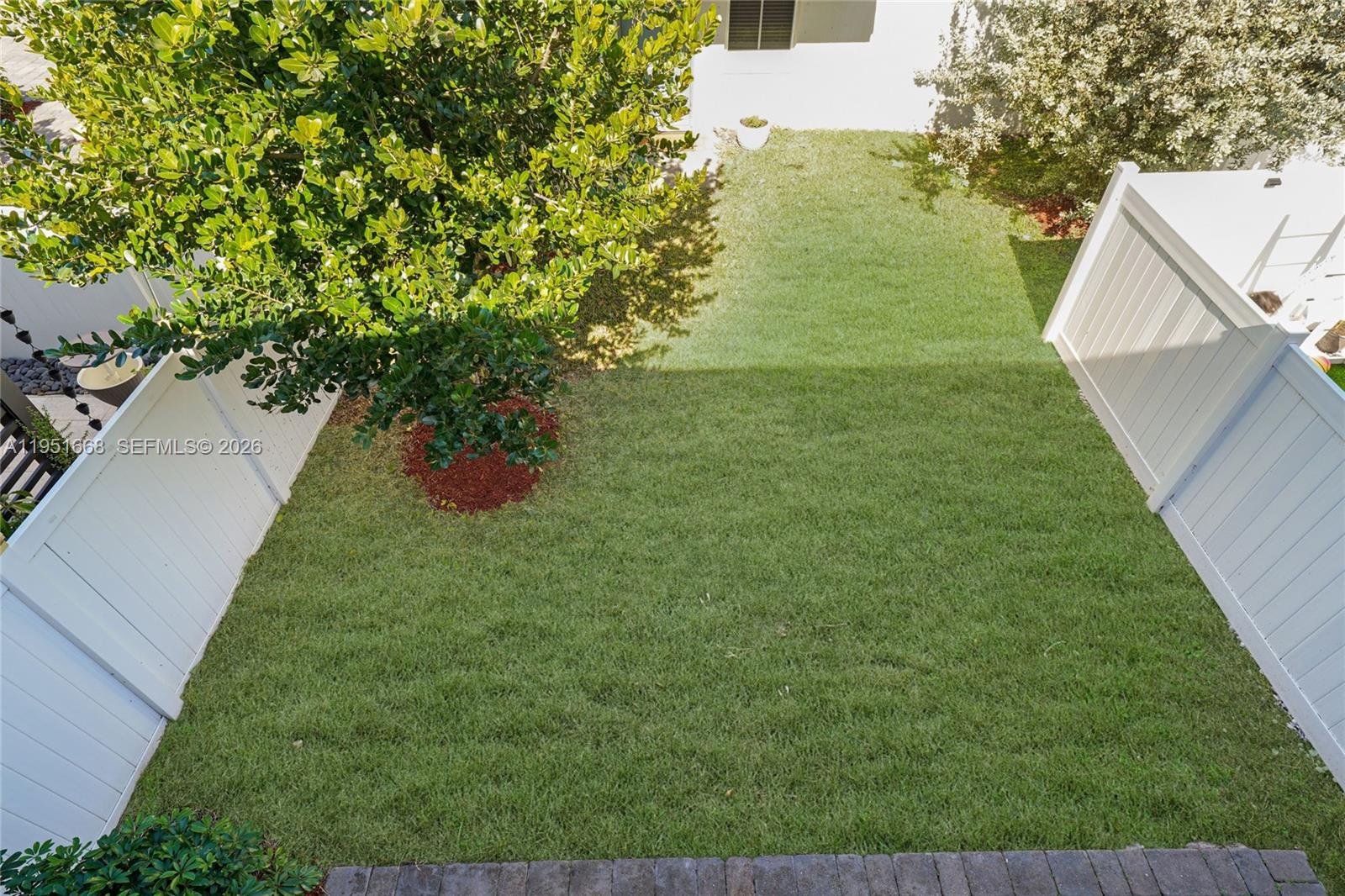 767 Southeast 18th Street Homestead, FL 33034 - Photo 26 of 29 a view of a garden