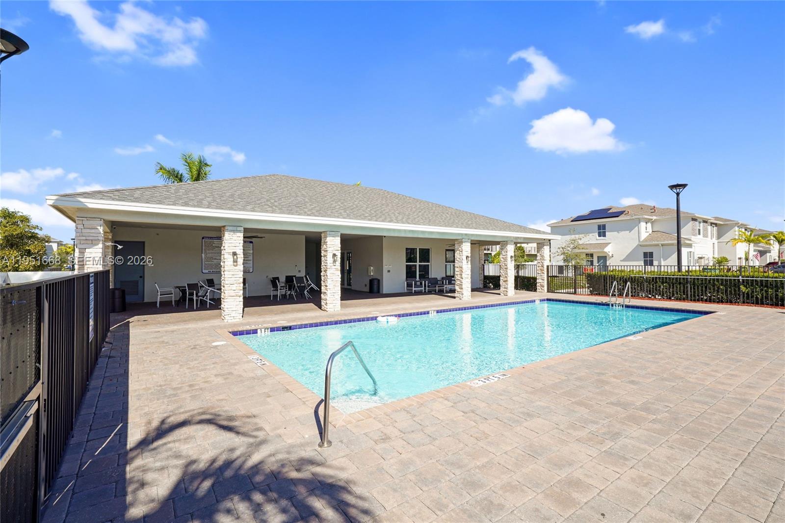767 Southeast 18th Street Homestead, FL 33034 - Photo 28 of 29 a view of a house with swimming pool and sitting area