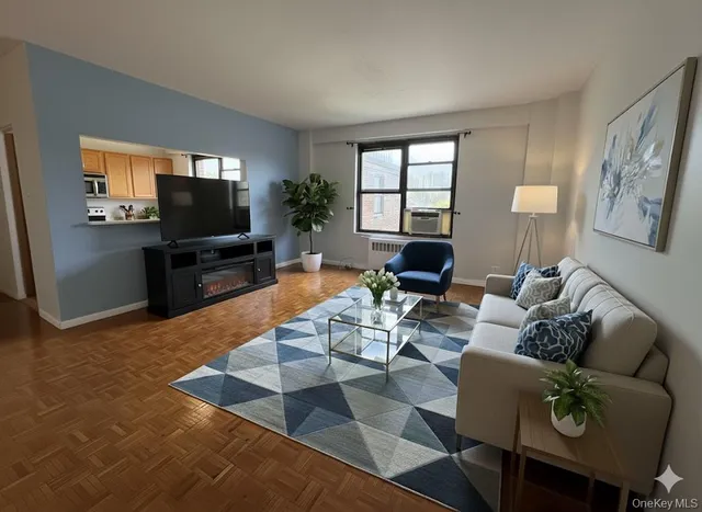 a living room with furniture and a flat screen tv